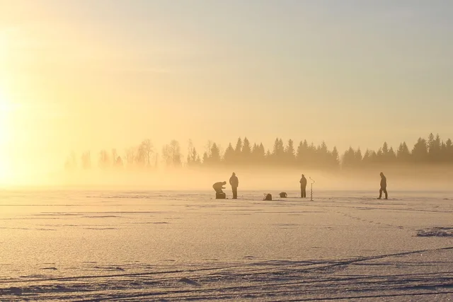 the fisherman, on ice, on a winter day. Calgary and Edmonton miniature work through dry air and long winters