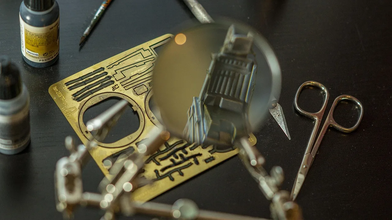 modelling, miniature, handcraft, hobby, workbench, plastic, table, magnifying glass, tools, photo-etched parts, scissors, color bottle, pilot seat. Work surfaces for miniature building, and how to judge one, updated for 2027