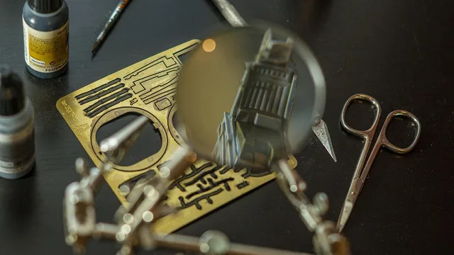 modelling, miniature, handcraft, hobby, workbench, plastic, table, magnifying glass, tools, photo-etched parts, scissors, color bottle, pilot seat. Work surfaces for miniature building, and how to judge one, updated for 2027
