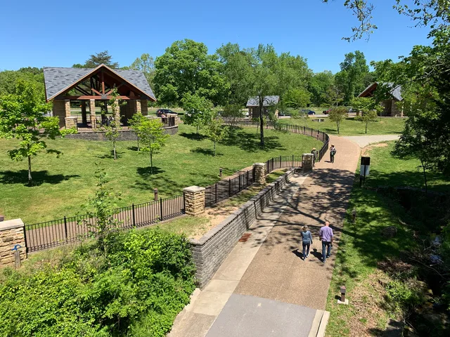 People walk along a trail behind the park visitor center. Miniature Diorama Reference from US National Parks: What Translates